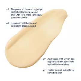Beige texture smear with four labeled callouts that read: 'The power of two cutting-edge biotechnologies, brytaR and TAP, for a more luminous, even complexion' and 'Helps correct the look of persistent discoloration.'