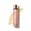 Even Intensive Skin Tone Correcting Serum bottle with product texture background