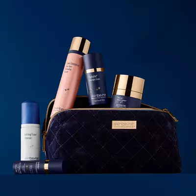 Skinbetter science product and bag on a dark blue background