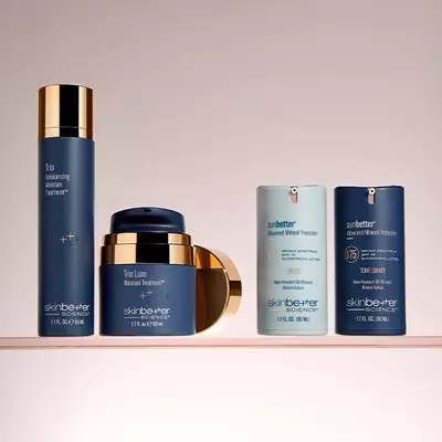 Three skinbetter science products lined up horizontally on a pale grey surface