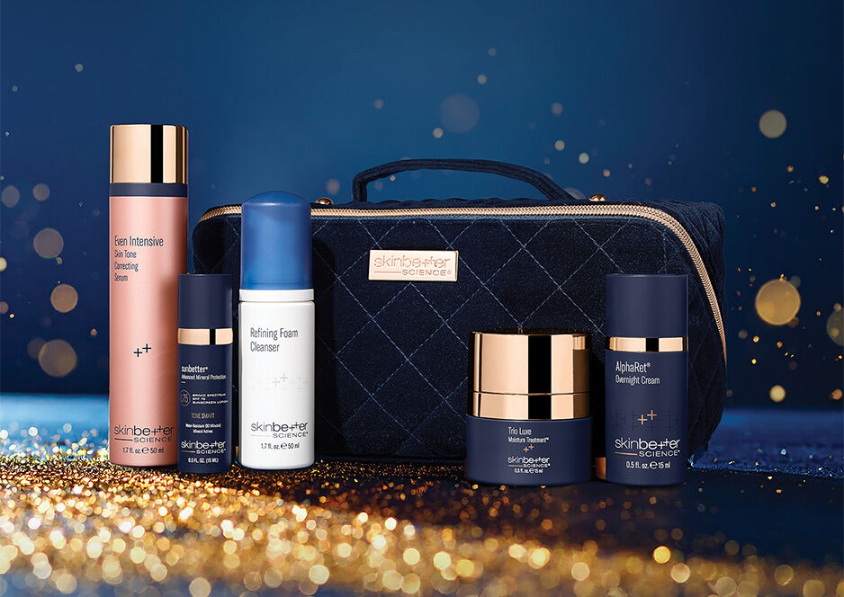 Products and gift bag on blue background with sparkles