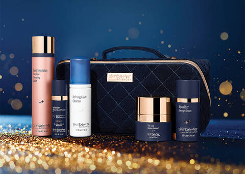 Products and gift bag on blue background with sparkles