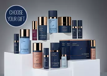 Assortment of skinbetter's most popular products in deluxe sizes, on a shelf with soft grey color background